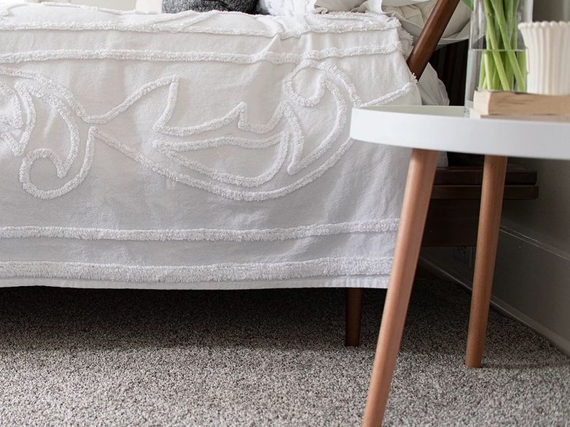 Bed covered in sheets from Cawood Flooring Systems in West Chester, OH