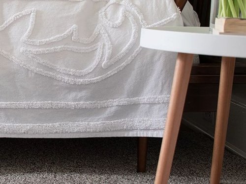 Bed covered in sheets from Cawood Flooring Systems in West Chester