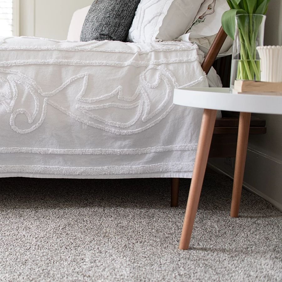 Bed covered in sheets from Cawood Flooring Systems in West Chester